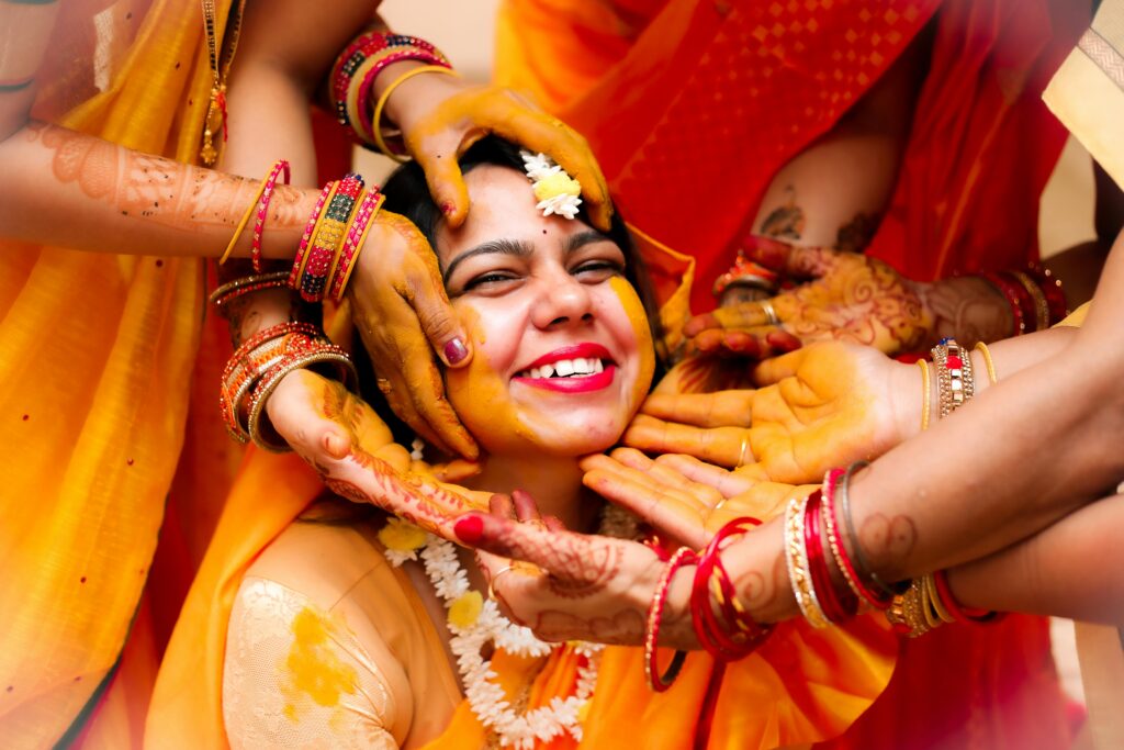 Indian girl applying turmeric powder 